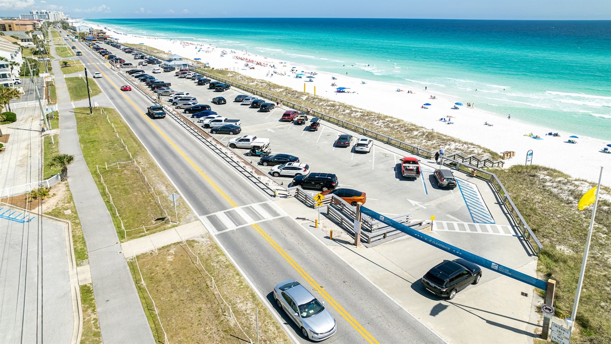 Aerial photo of the beach-access crosswalk, public parking and beach walkover across Scenic Gulf Drive